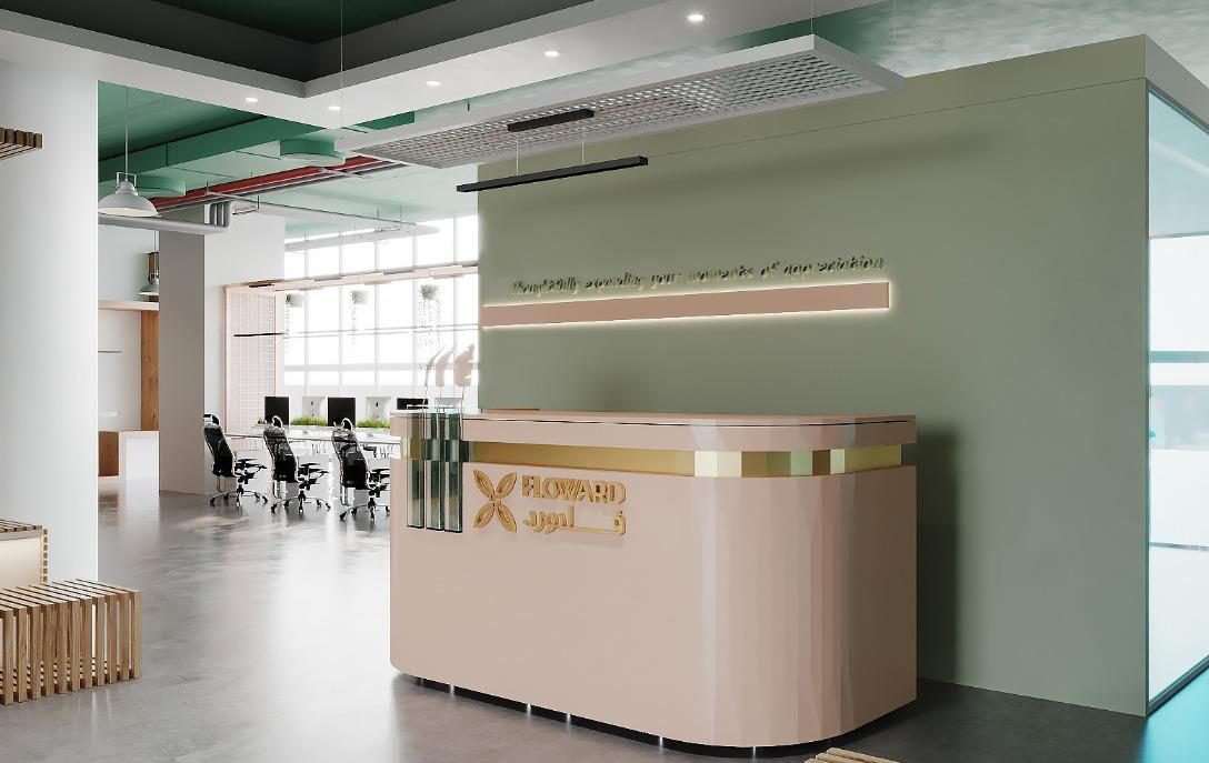 Reception area with the brand wall and planting behind