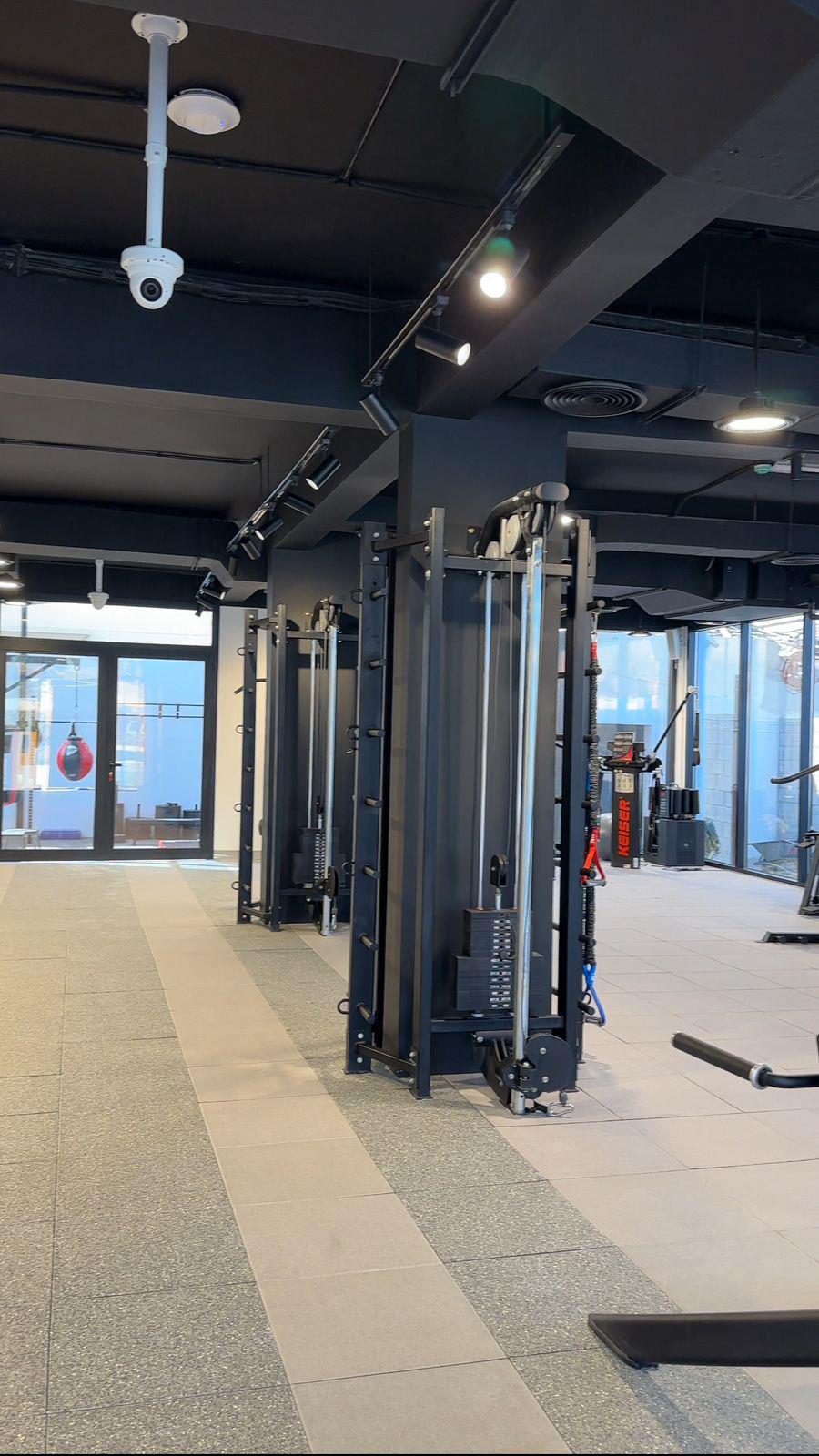 Training floor with steel rigs, rubber flooring and exposed ceiling services