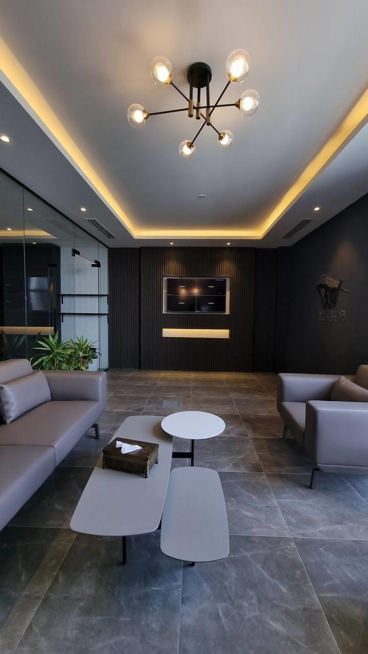 Open office floor with glazed offices along the window line